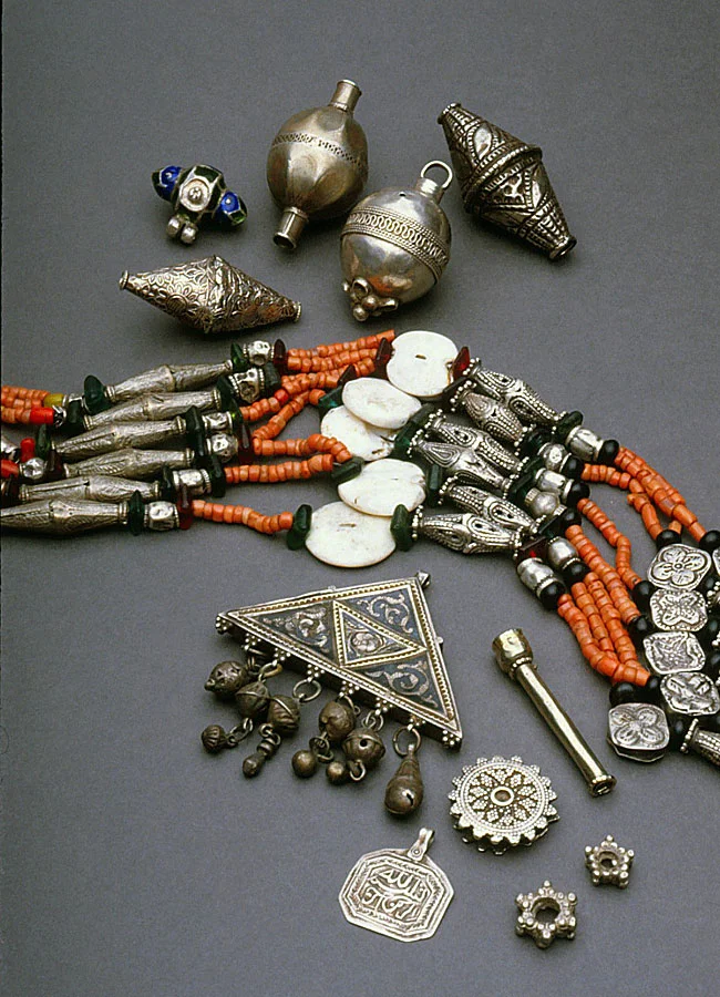 Ethnographic silver beads, components, amulet and necklace from Afghanistan; necklace uses shell and coral beads. RKL