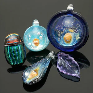 Contemporary art glass beads by Keith Kreitter (3 pendants), Bruce St. John Maher (scarab) and Donna Nova (leaf). CW
