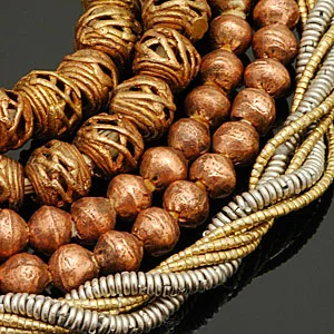 Brass, copper, and white metal beads from Africa. CW