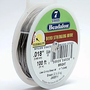 Spool of Beadalon brand cable wire for bead stringing. CW