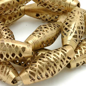 Brass beads from Ghana that have been polished smooth on a grinding wheel. CW