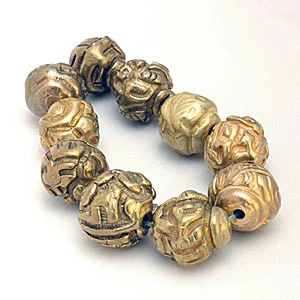 Chinese brass buttons that have been converted into beads. CW