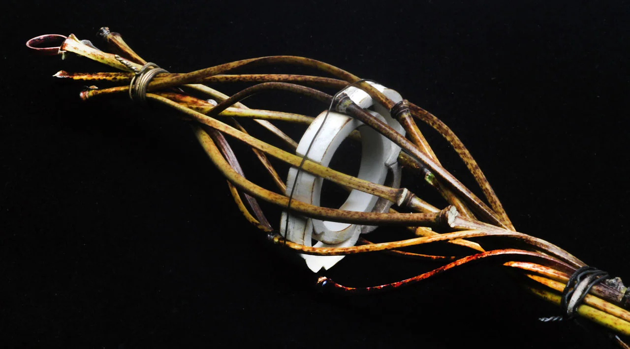 CLOSEUP OF JIGGED PENDANT, still with temporary wirebinding and plastic pipe jig in place. Note that individual culms have pleasing curves and the swirled bamboo has much more shape and resemblance to a basket or lattice-work.