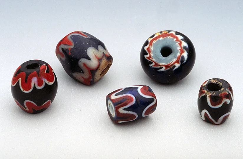 Lampworked imitation chevron beads, possibly Chinese-made, from Kalimantan, Borneo (0.65 to 1.0 cm diameters). RKL