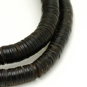 Coconut shell disc or heishi beads from West Africa. CW