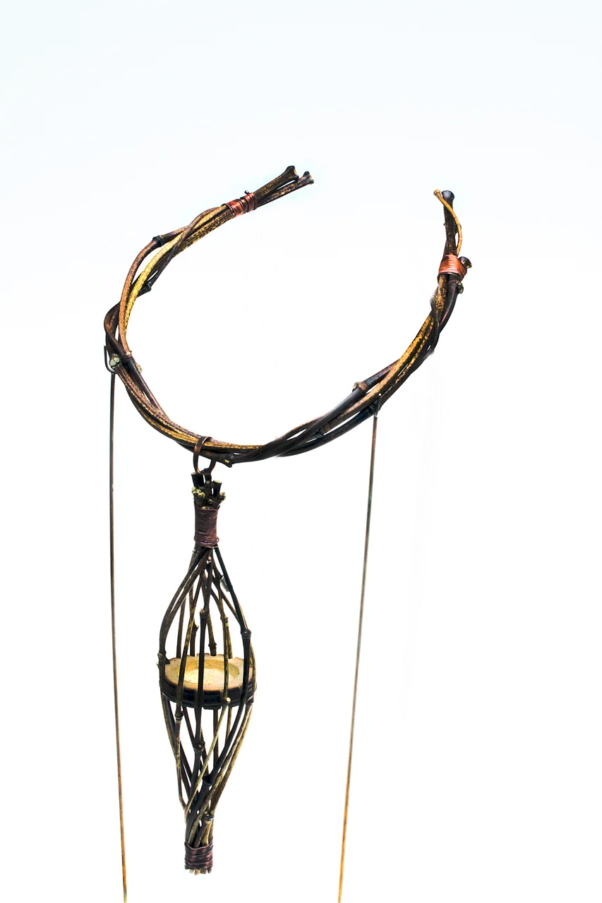 FINISHED PENDANT AND TORQUE, with wire-wrapped near ends of intertwined torque. Pendant is 17.0 cm long, torque 12.5 cm wide. Neckpiece is held in 2 rod arms of armature for photography.