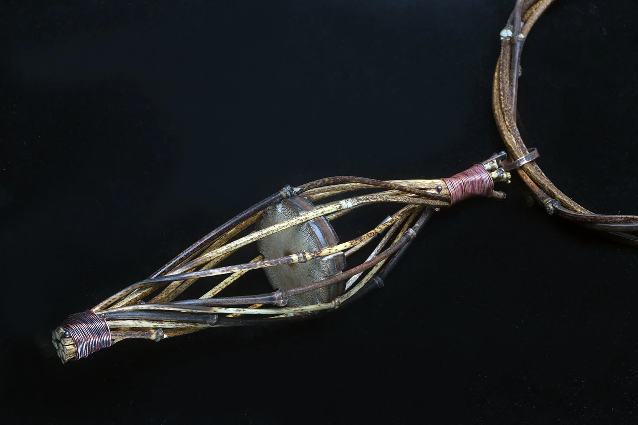 CLOSEUP OF FINISHED PENDANT AND PORTION OF TORQUE, with lower culms sawed off.