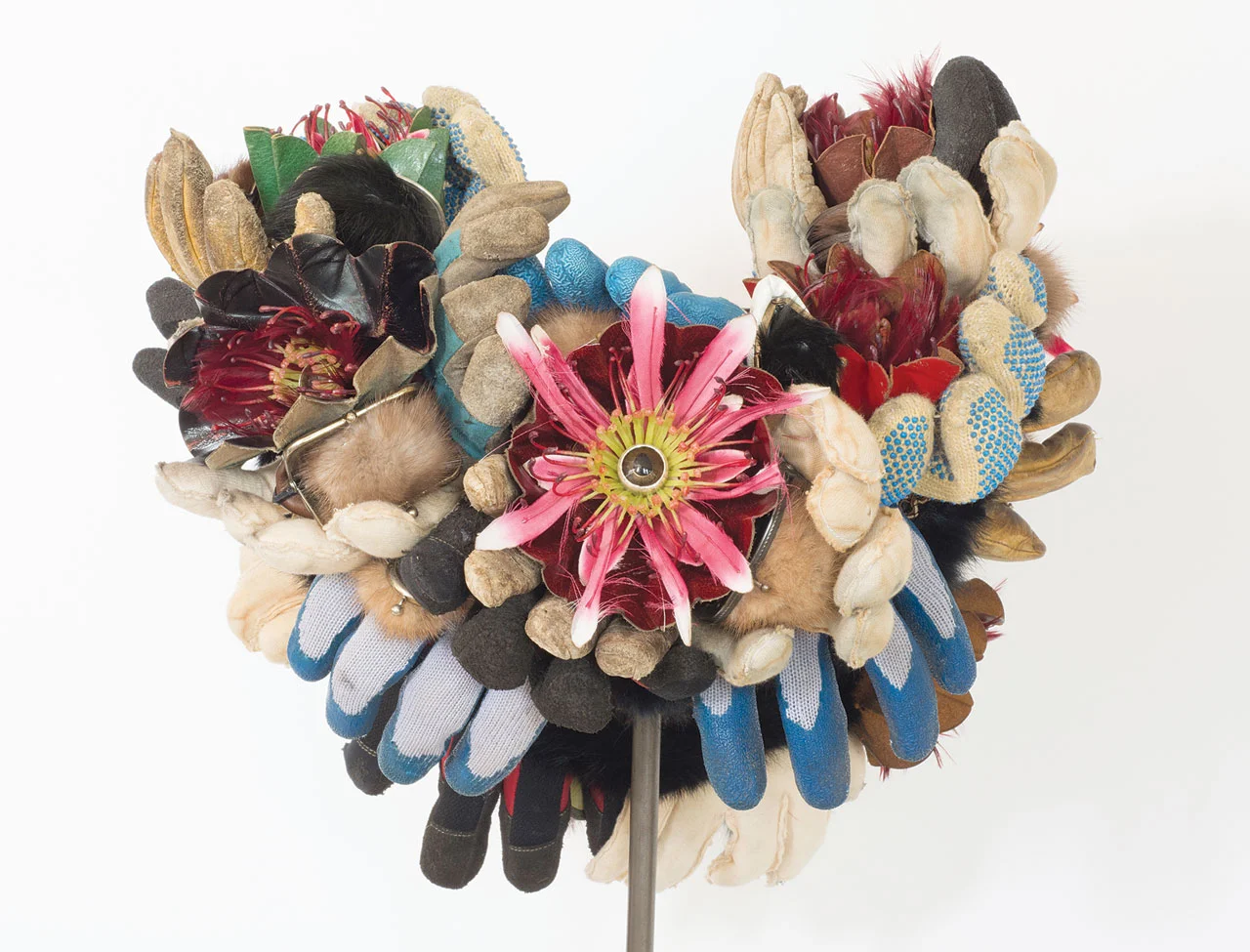 SEXUAL HARASSMENT IN THE WORKPLACE NECKPIECE of silver, glass, wool, plastic, nylon, fur, leather, feathers, steel, 63.5 x 45.7 x 19.1 centimeters, 2018. Photographs by Rex Rystedt.
