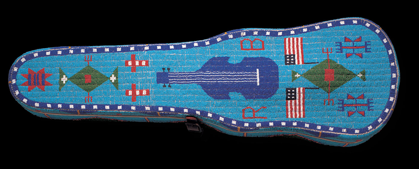 VIOLIN CASE, Brulé Lakota, Rosebud Indian Reservation, South Dakota, of commercial wood case, native-tanned hide, metal trim, glass beads, 81.3 x 25.4 x 11.4 centimeters, 1891. Courtesy of Stars and Stripes Foundation.