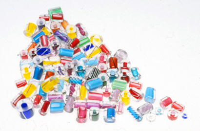 Large assortment of contemporary drawn glass beads made from many different canes. These were most likely made by Fineline Studios. RKL