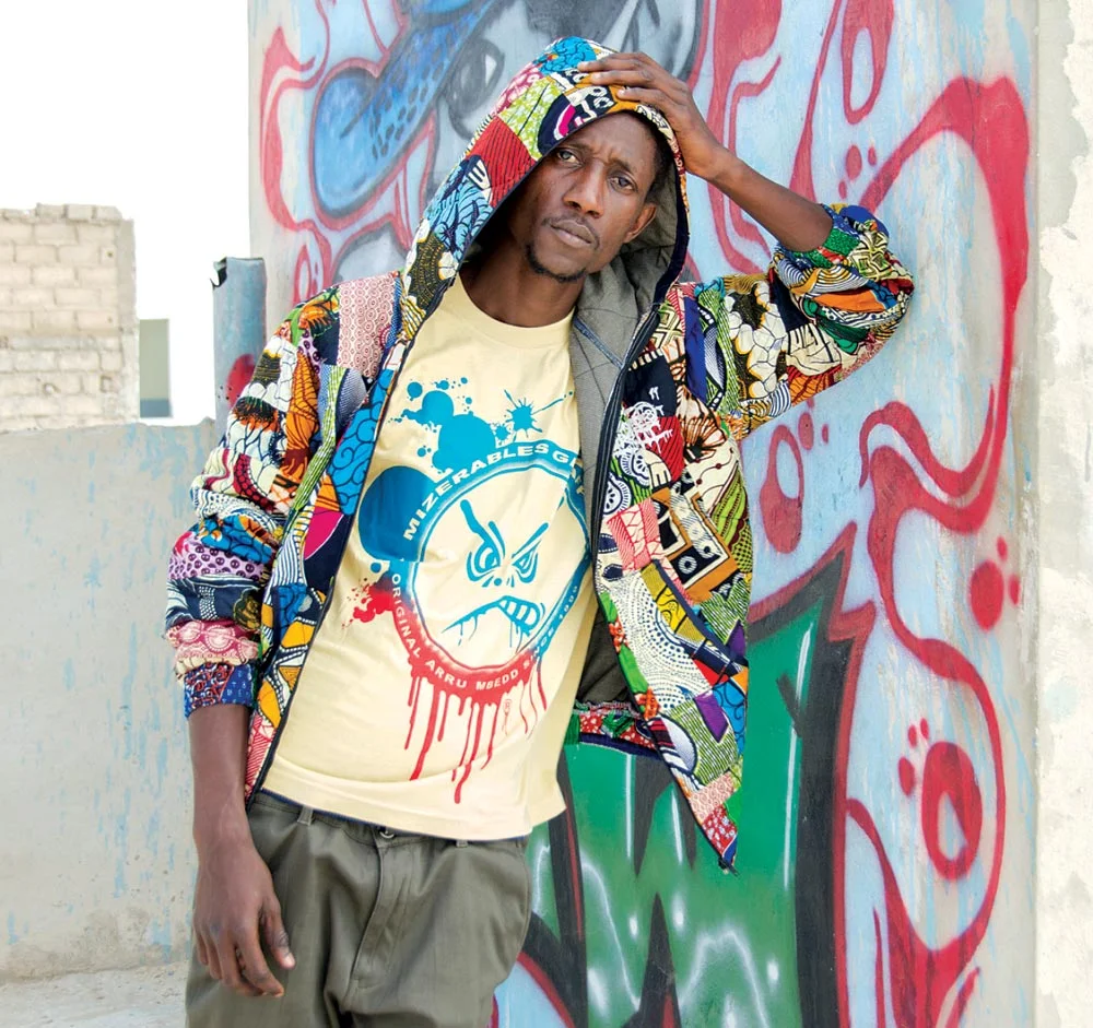 DEEP DAKART, DESIGNER FOR MIZÉRABLES GRAFFF. HOODIE AND T-SHIRT of African-print cloth, 2016. Photograph by Leslie W. Rabine.