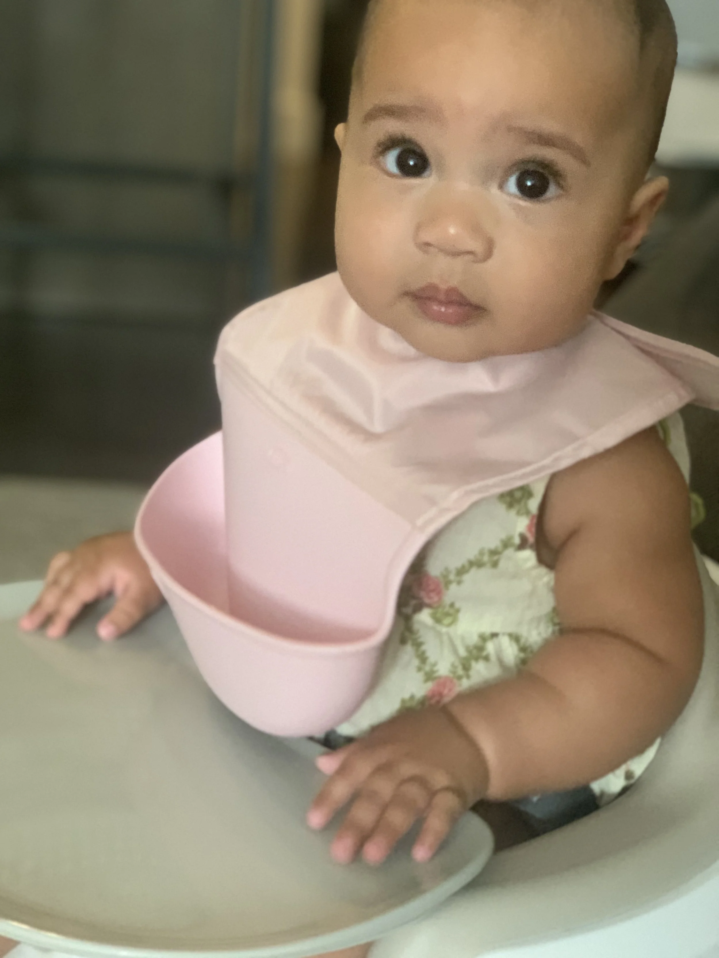 Trying her first solids