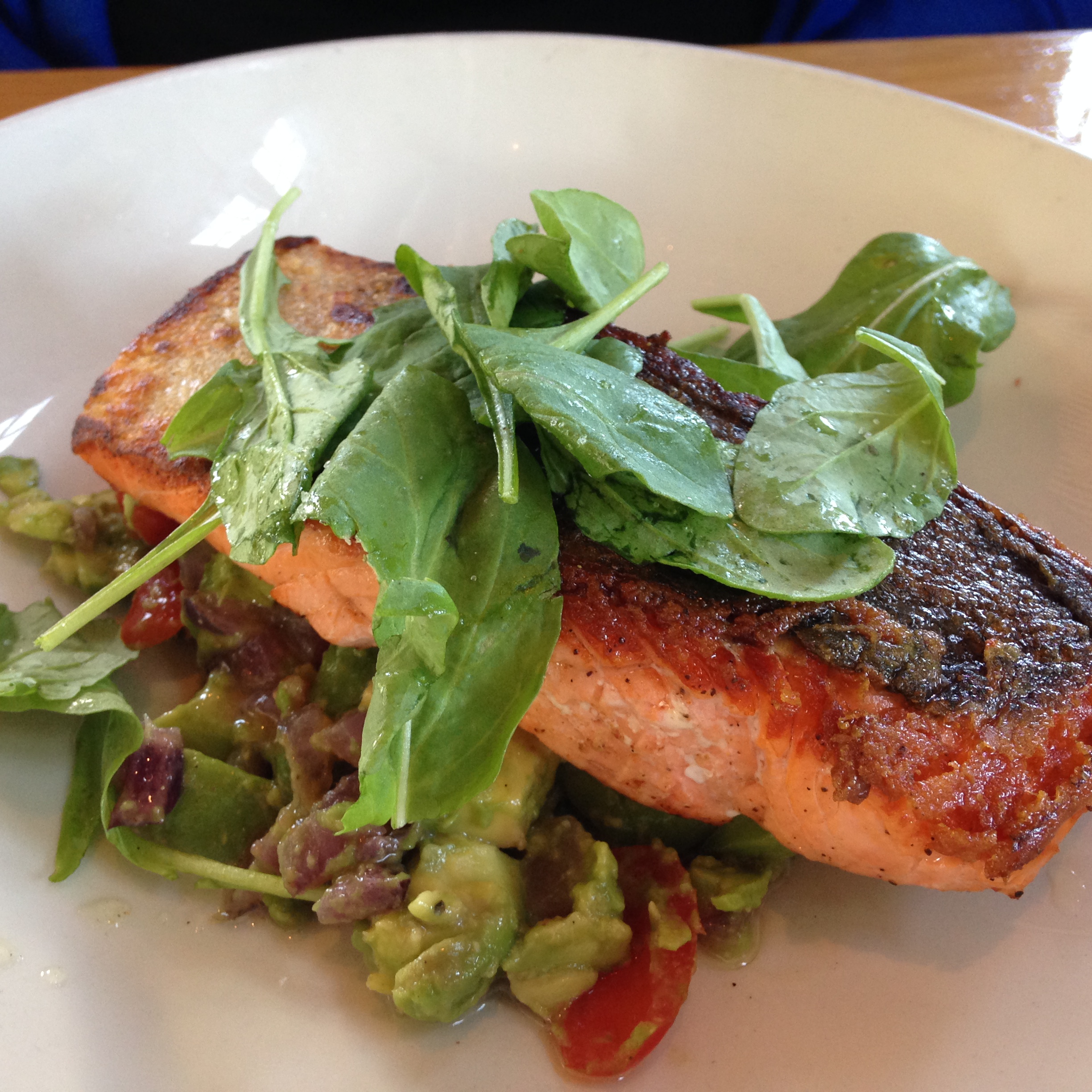 Seared Coho Salmon on bed of Avocado, Sautéed Red Onions and Cherry Tomatoes w/ a Citrus Vinaigrette