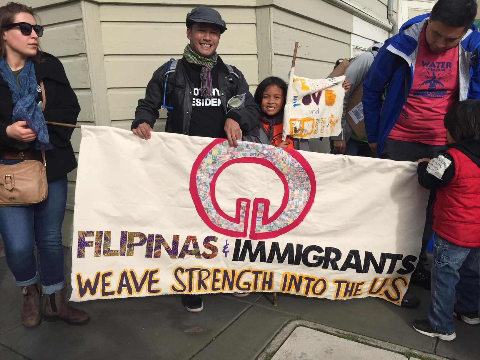 Leo marching for immigrants with the Sama Sama Cooperative (samasamacooperative.org)