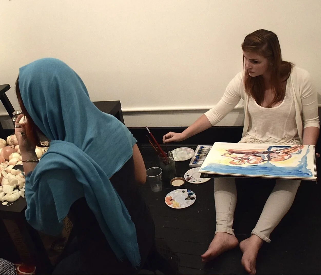 Featured Artist, Ursula Beck. During the event, painter, Ursula Beck captured guests with watercolor sketches using collected tears to wet her brush. © Miko Kuro’s Midnight Tea, 2014.