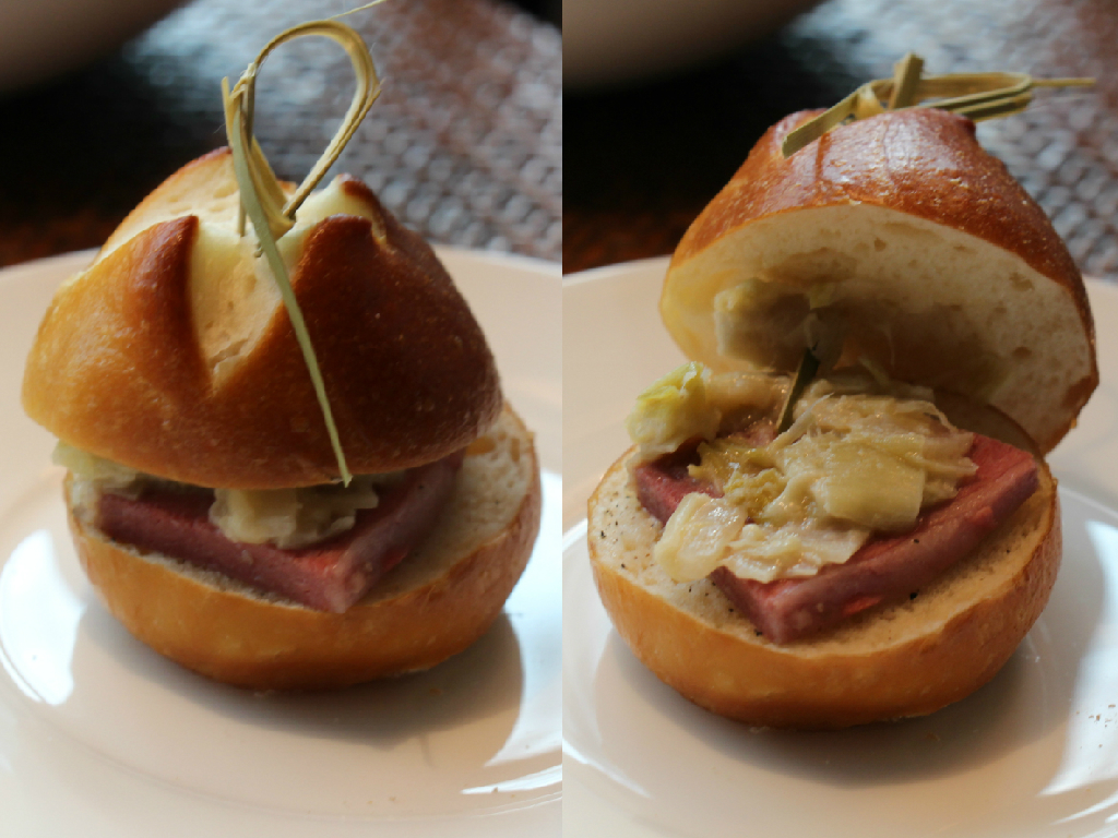 Seasoned tender beef served on two slices of pretzel bun 