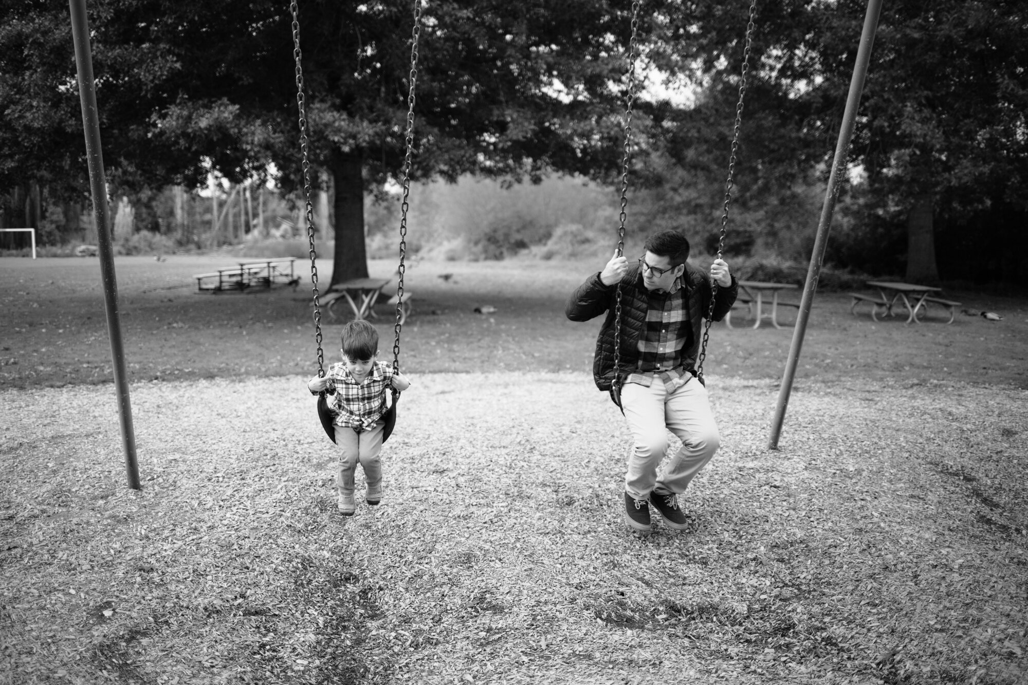 Father and son on swing set