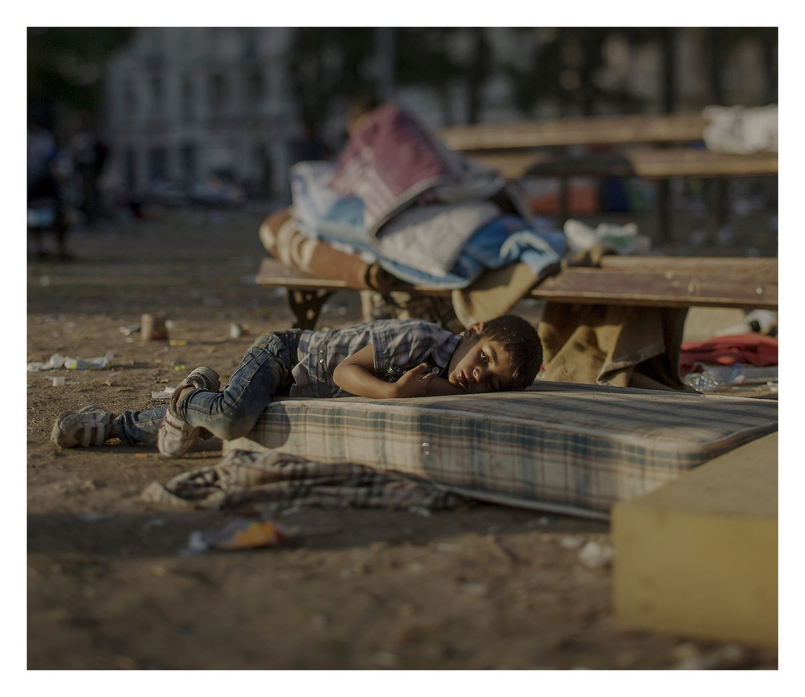 Abdullah has a blood disease. For the last two days he has been sleeping outside of the central station in Belgrade. He saw the killing of his sister in their home in Daraa. He is still in shock and has nightmares every night, says his mother. Abdullah is tired and is not healthy, but his mother does not have any money to buy medicine for him. IMAGE: MAGNUS WENNMAN/AFTONBLADET/REX USA