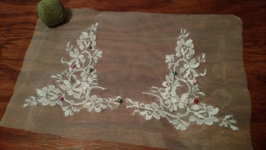 Lace from the reception dress on organza to create lace hand appliques