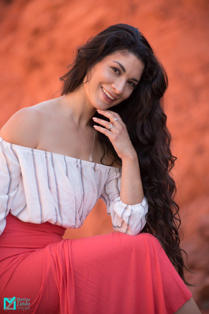 beauty woman long black hair red dress red rocks