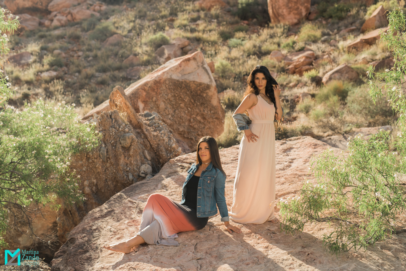 friends posing on rock afternoon sun