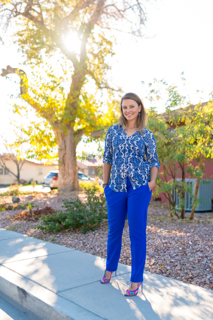 Martina smiling outside with  bright blue outfit