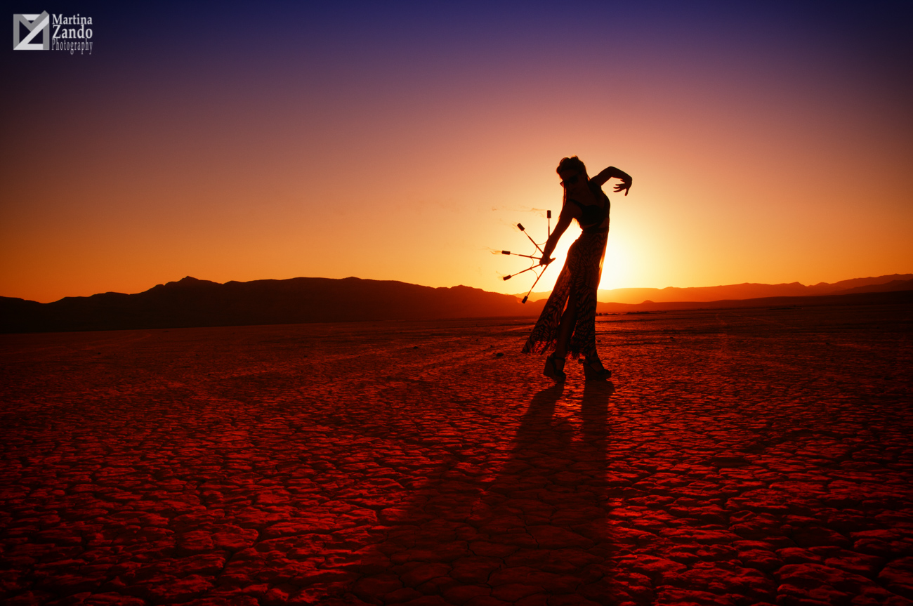 fire performer silhouette in the desert
