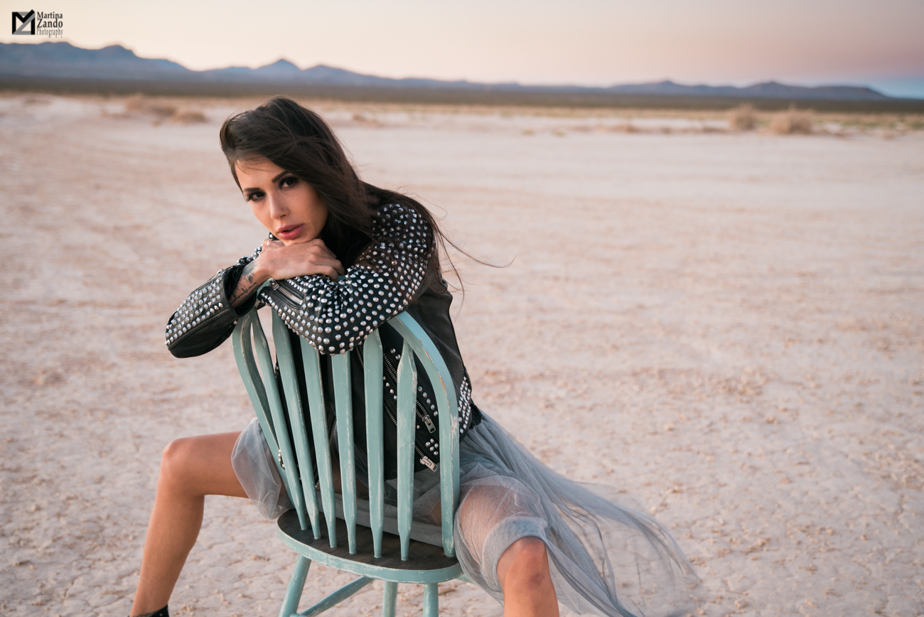 desert fashion shoot Naty Ashba on chair