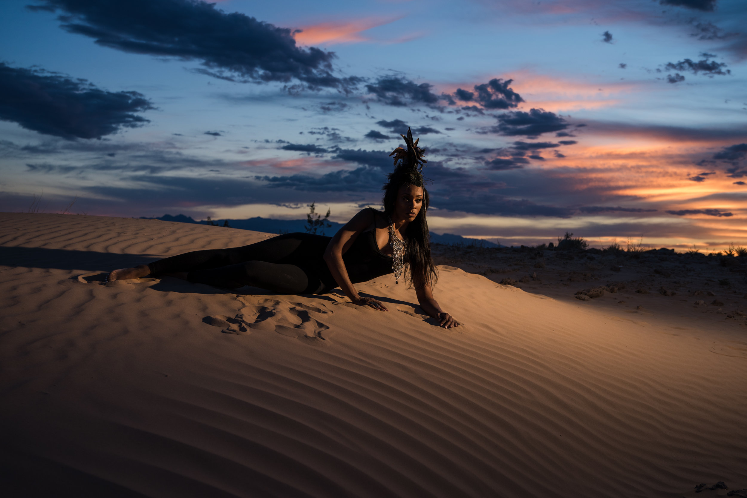 elegantly posed woman in fashion sunset desert