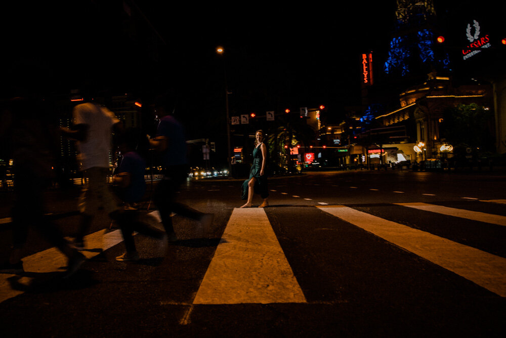 woman crosses las vegas boulevard with very few people