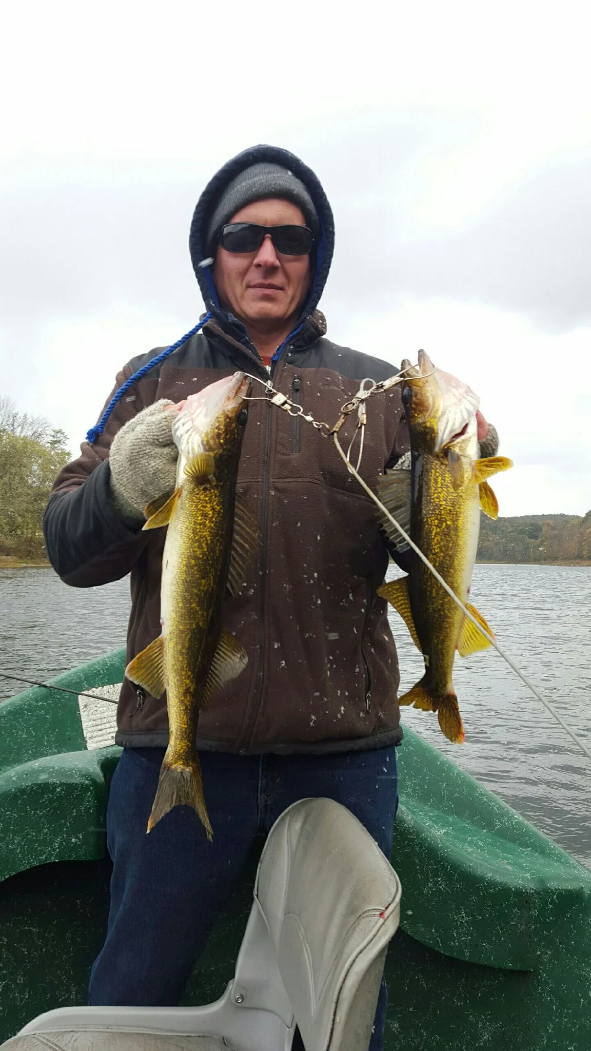 10/18/15Derek D. Proudly displaying his keeper catch during a snow squall.