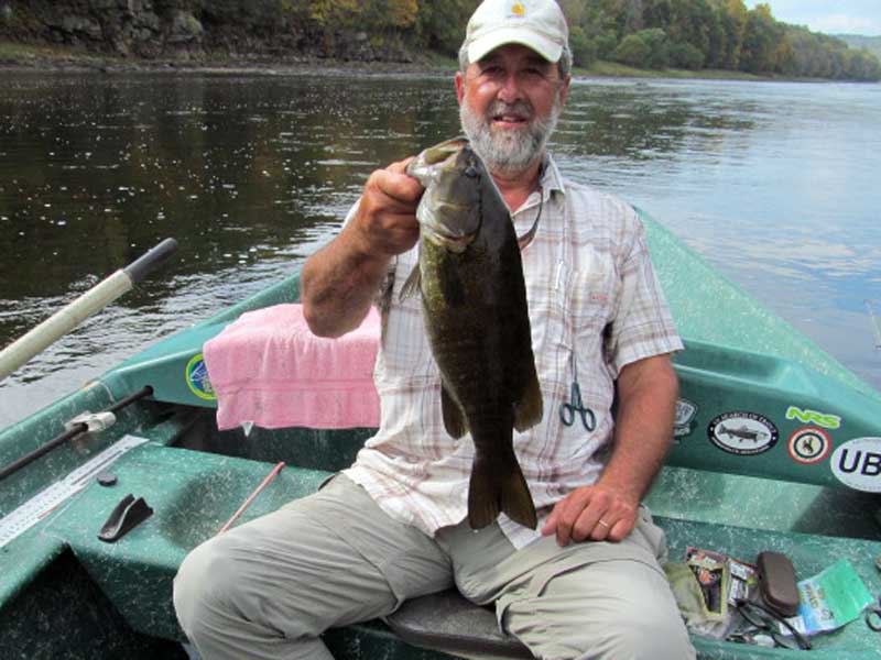 Guide Mike P. with a 20" Smallmouth Bass