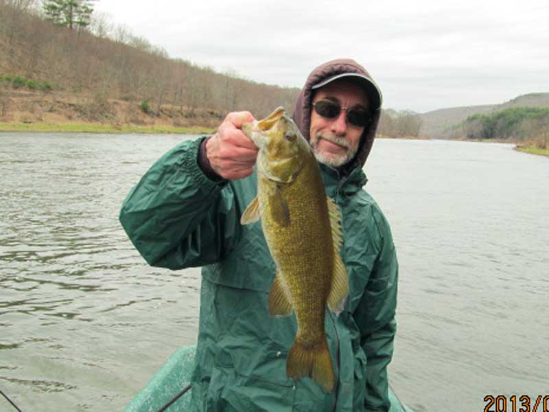 Roger S. with a 20" Smallmouth bass