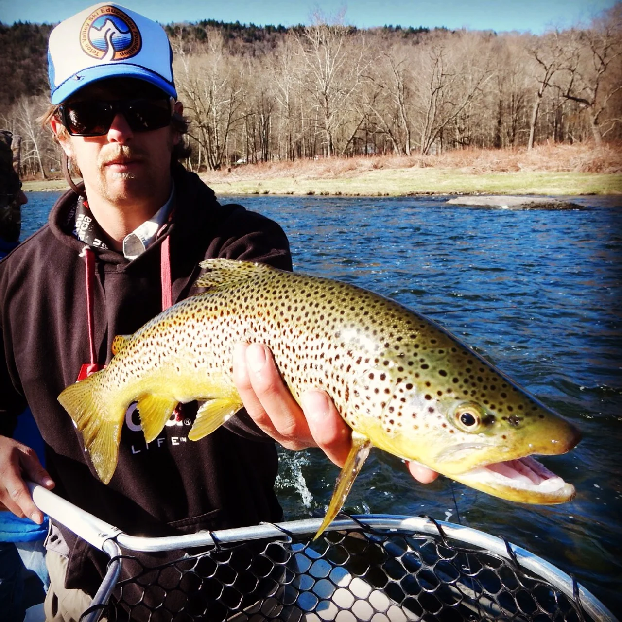 A nice brown trout displayed by guide Evan P.
