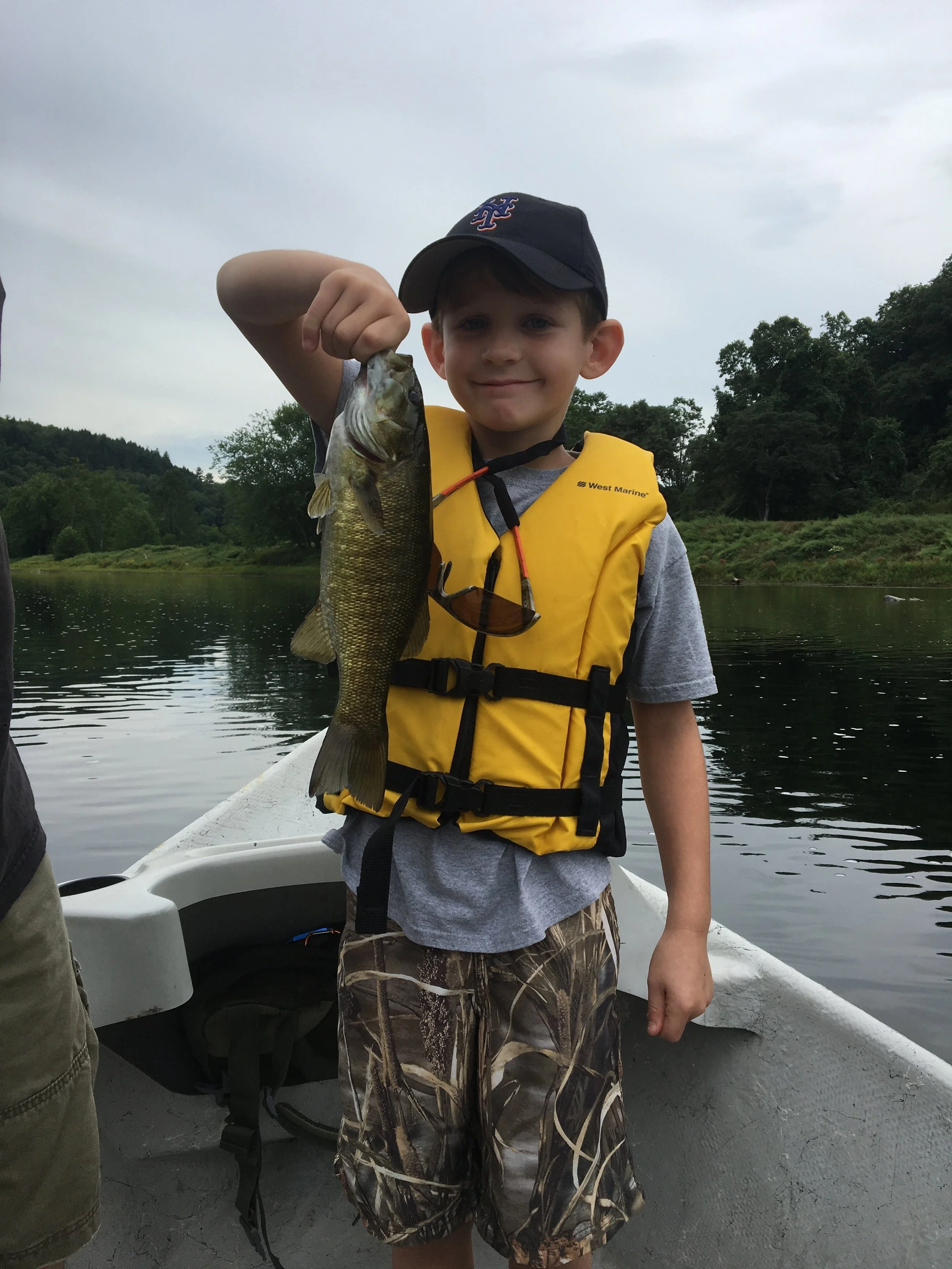 A young Mets fan gets a nice Smallmouth!