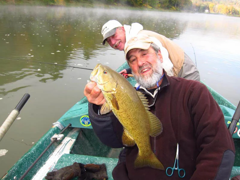 Guide Mike displaying Andy S.'s hefty Smallmouth Bass.