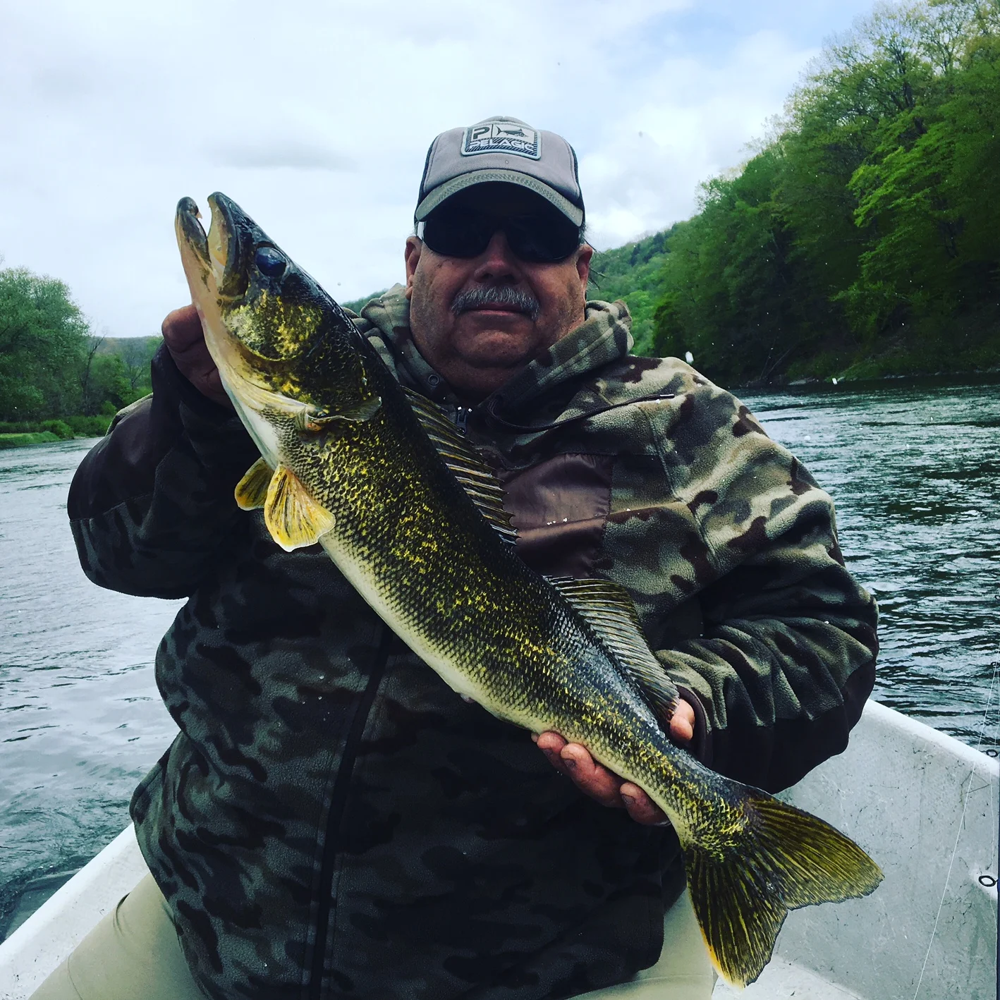 "Randy" with a 27" Walleye at the end of a long weathery day.