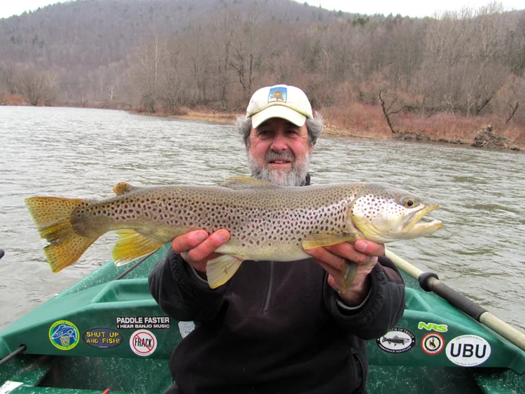 Guide Mike P. with an early season two foot Brown Trout!