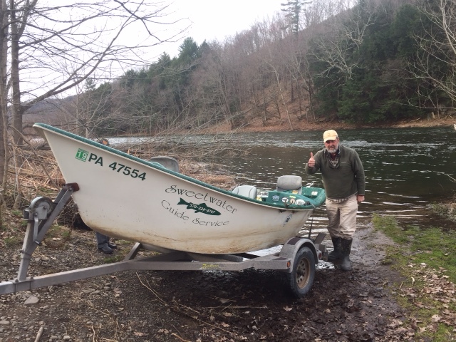 Guide Mike P. launching the boat into the West Branch.