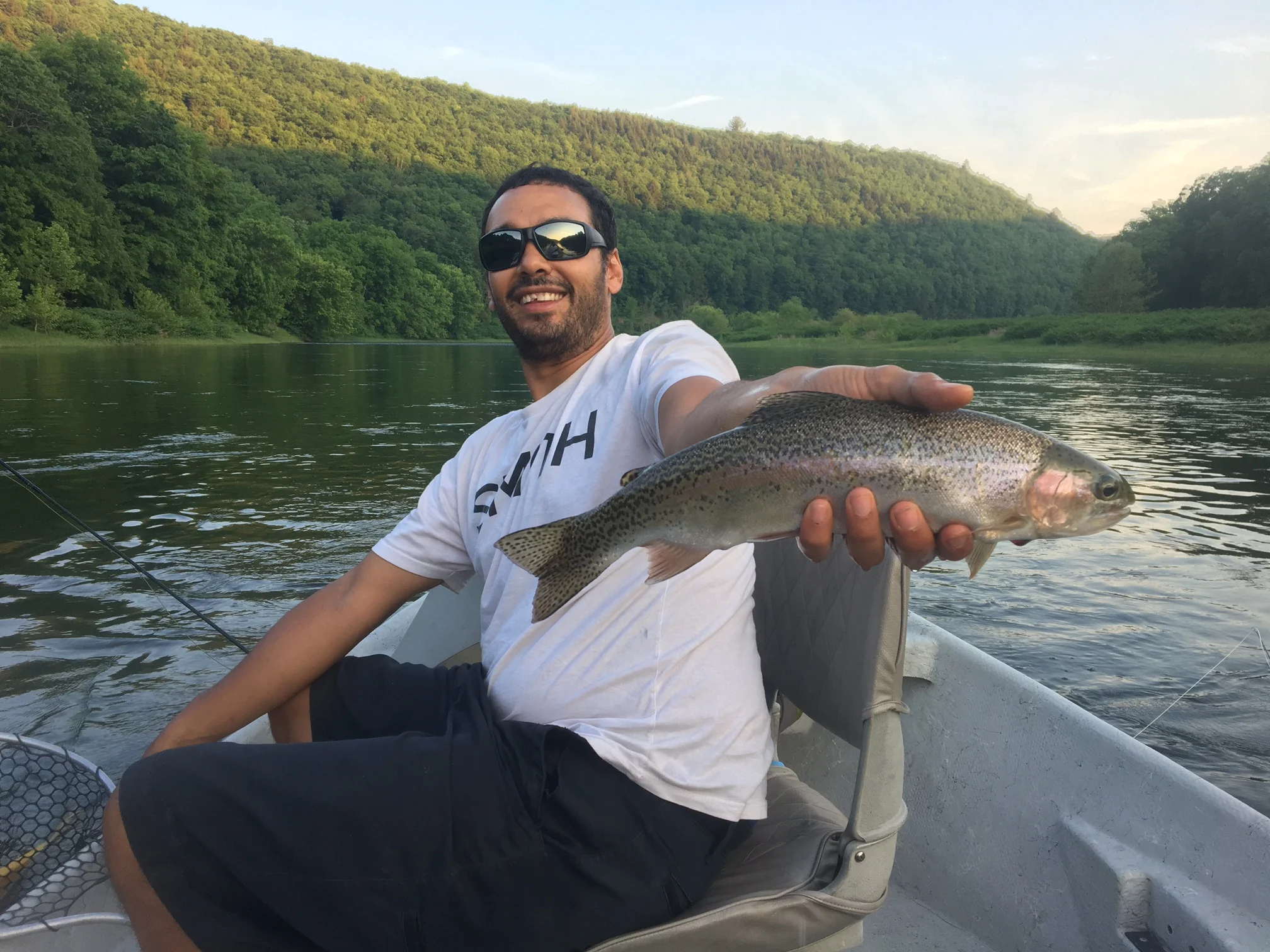 Sean R. with a Rainbow on the dry fly.