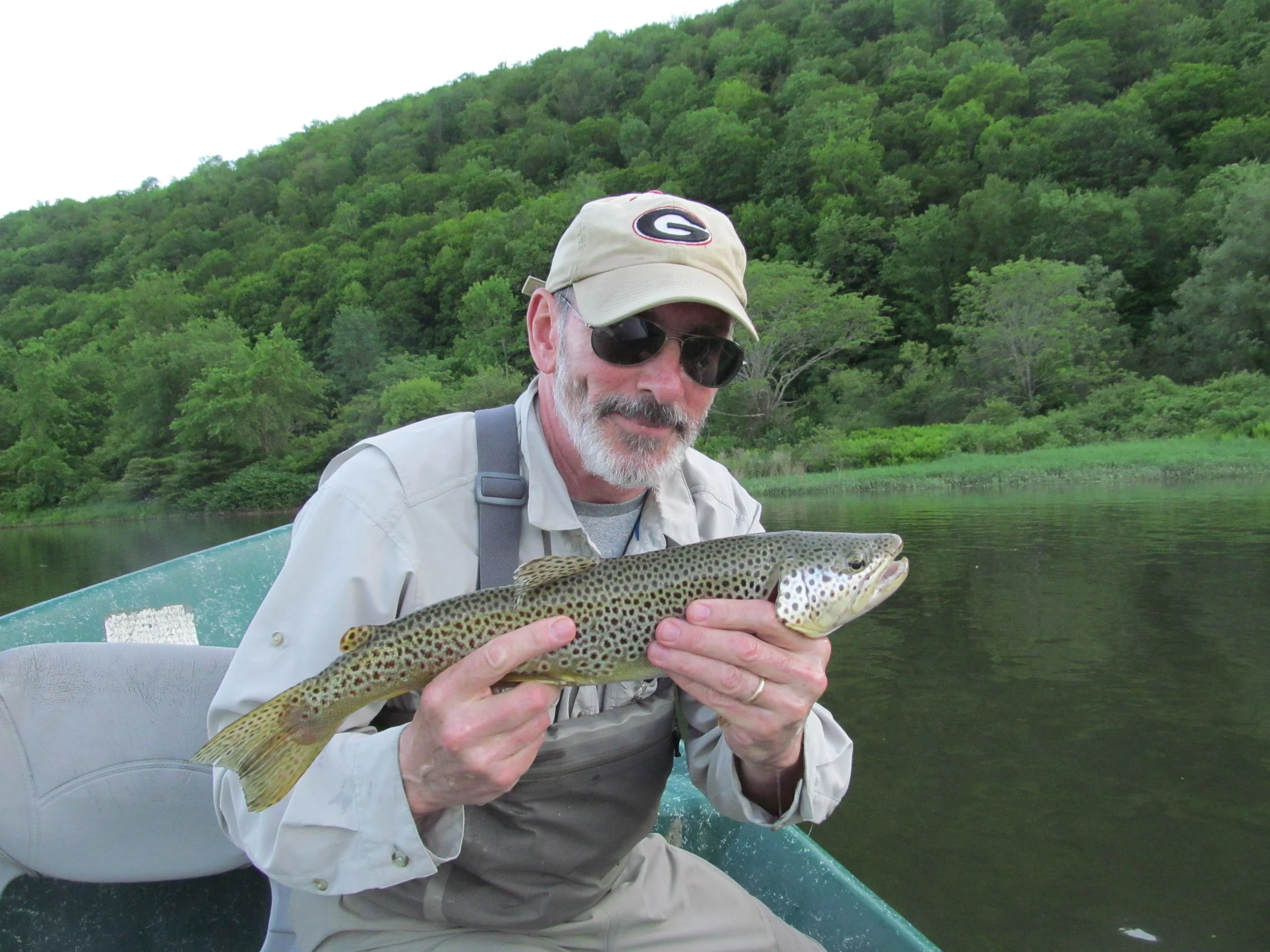 Bruce S. with a 20" brown on a dry fly.