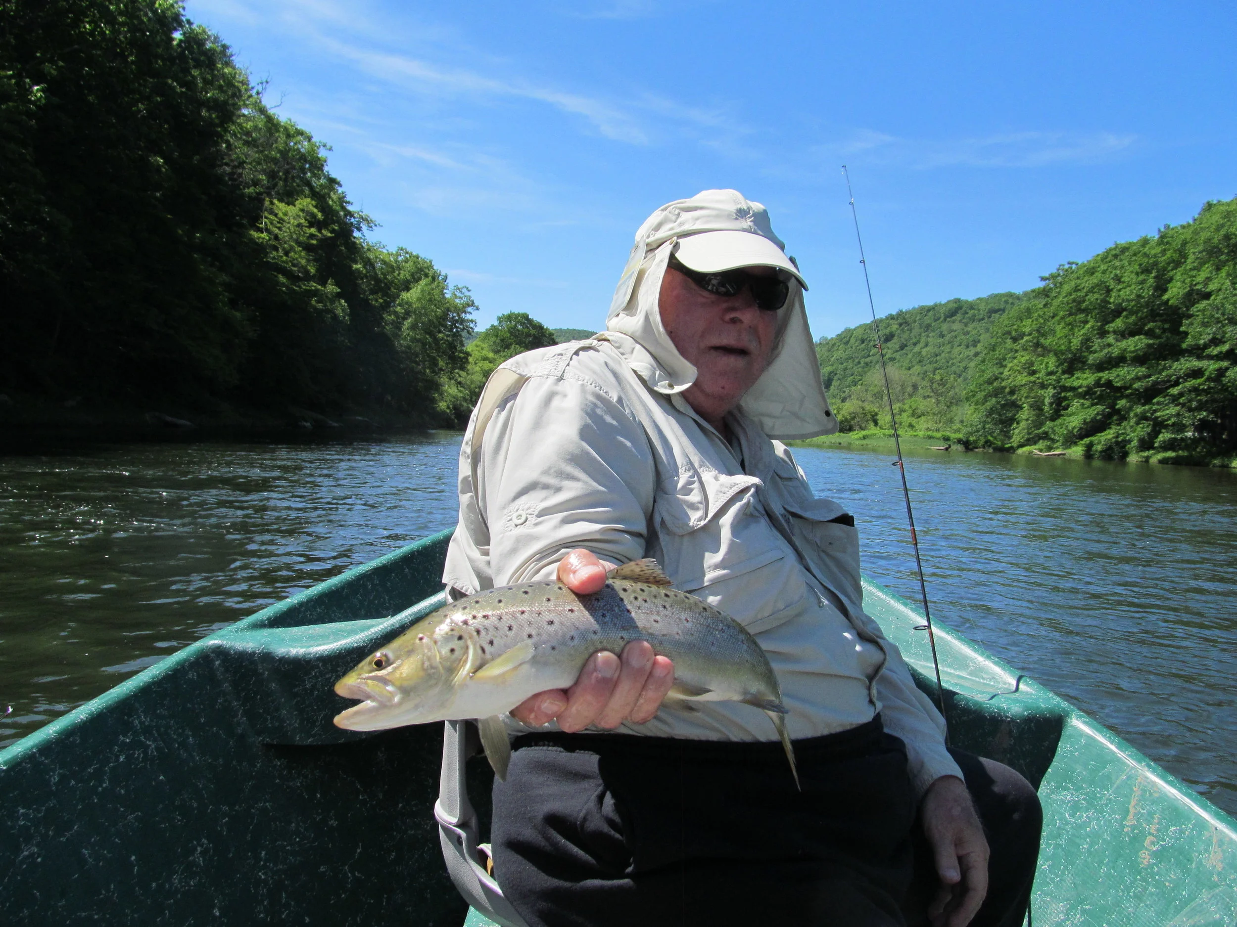 Tom G. holding a prize West Branch Brown trout.