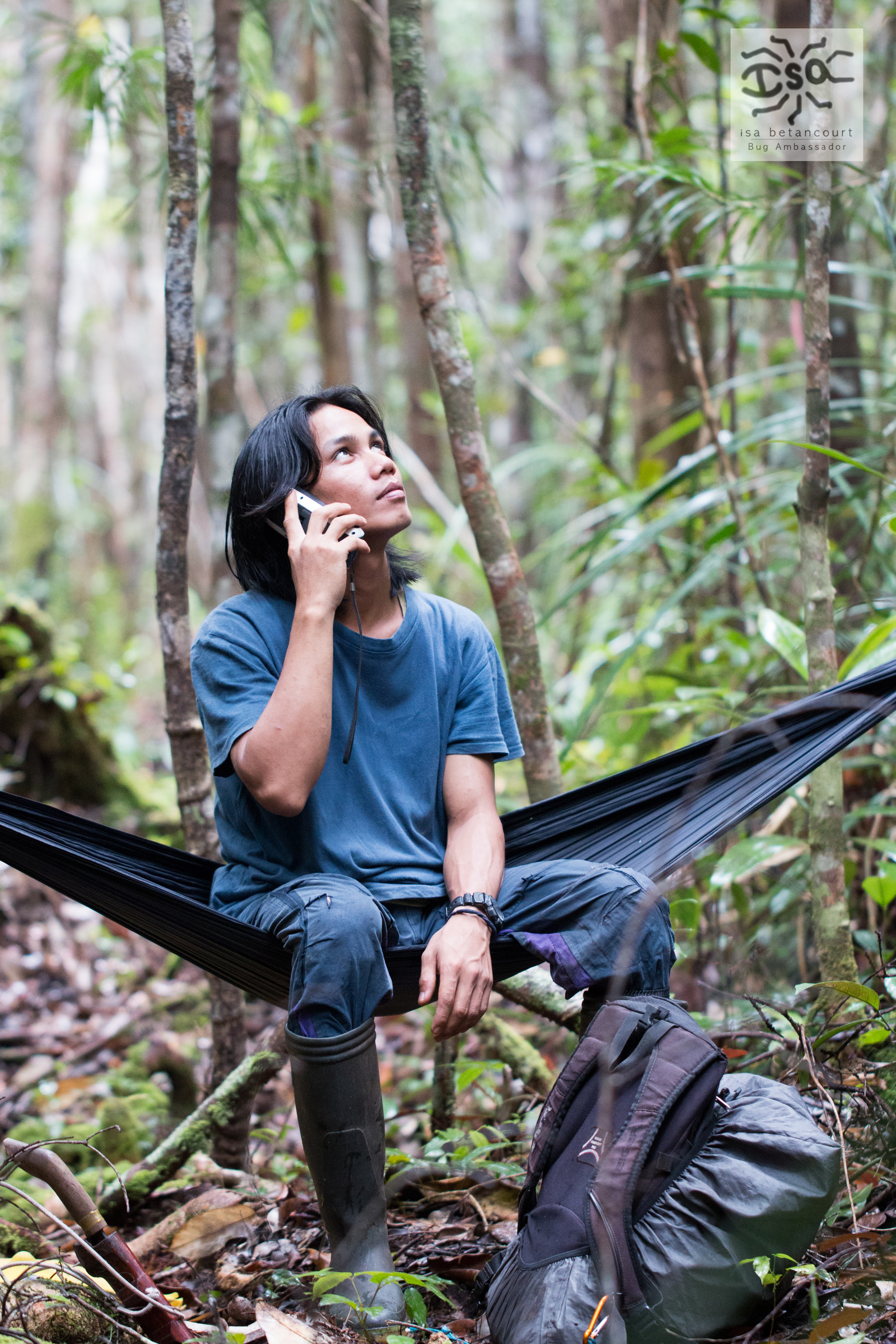  Local research assistant, Idun, poses for the camera goofily by holding the GPS up to his ear as if it is a phone. (Tuanan Orangutan Research Project) 