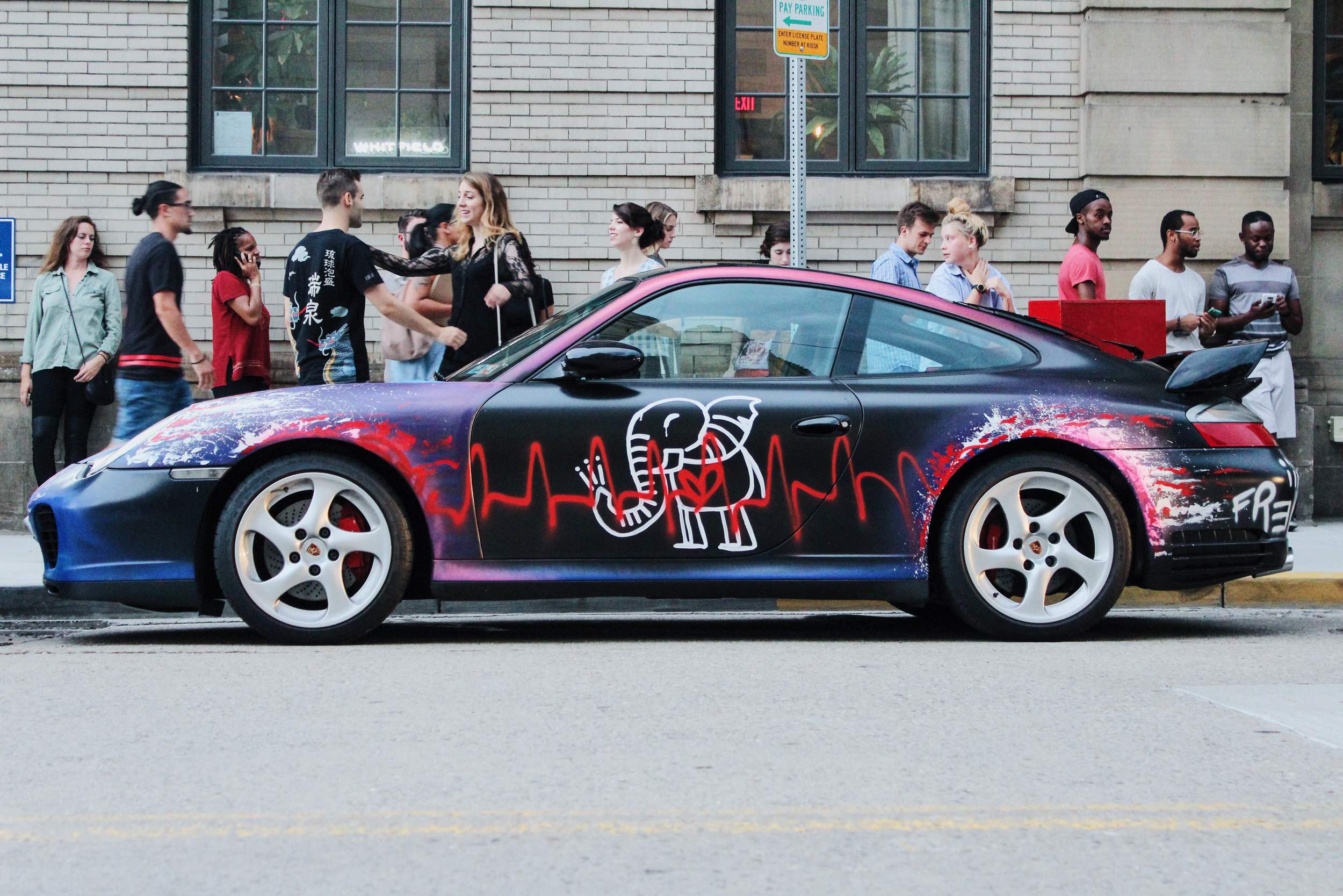 Art car painted by Baron Batch outside of CD6