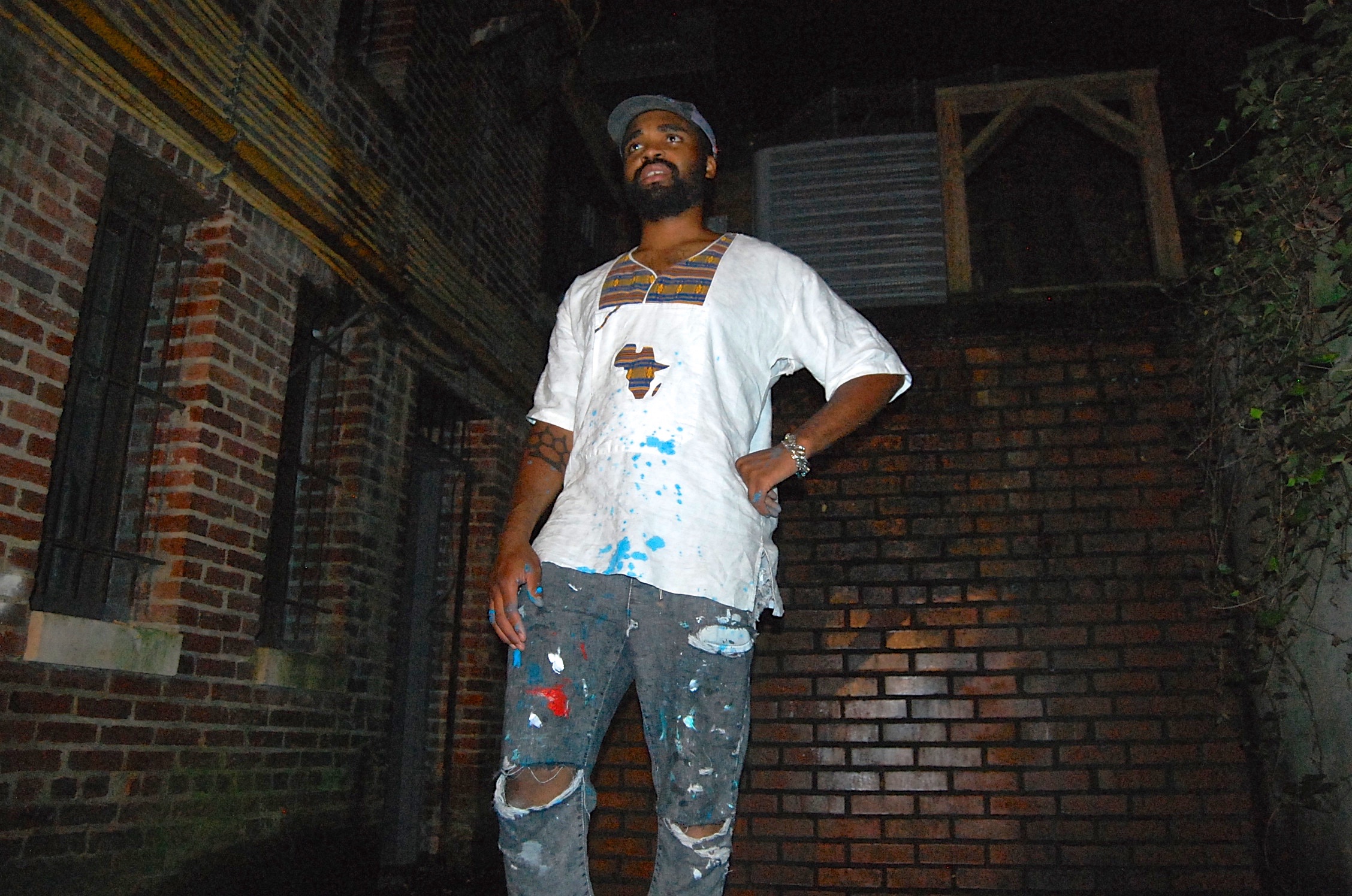 Artist Mensa A. Kondo outside of Uptown Art House. Photograph by Maxwell Young