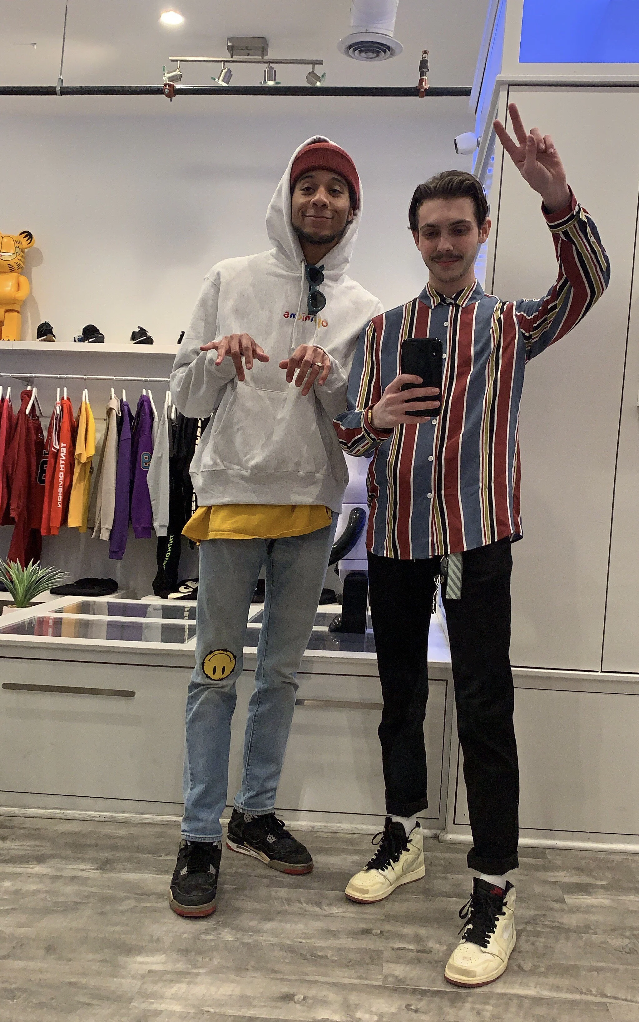 Alex Young (left) and Tyler Calpin (right) in front of the infamous fit pic mirror at Social Status. | photograph by Tyler Calpin