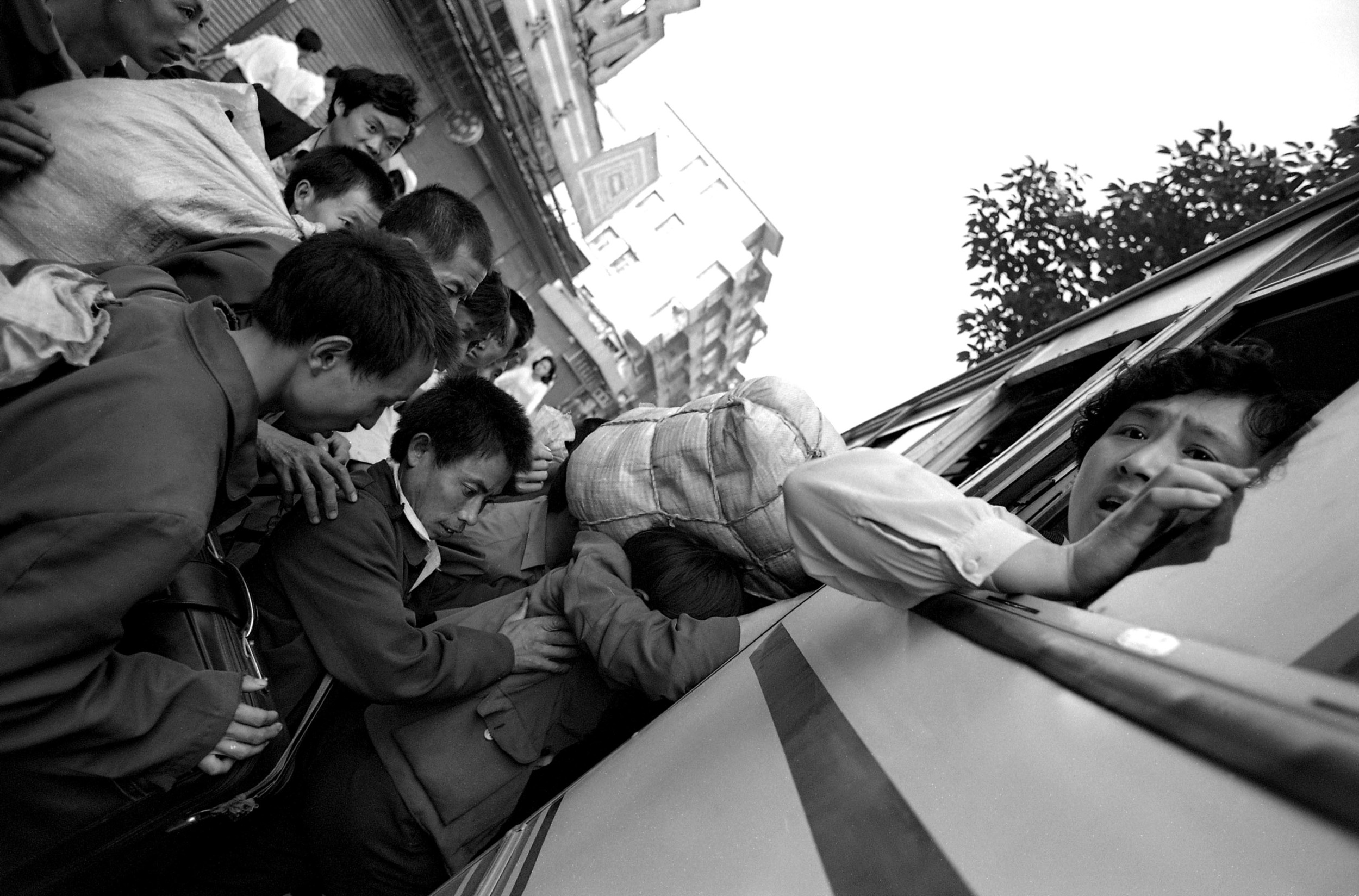 Canton Station Migrant Workers Crowd Bus Hi Res.jpg