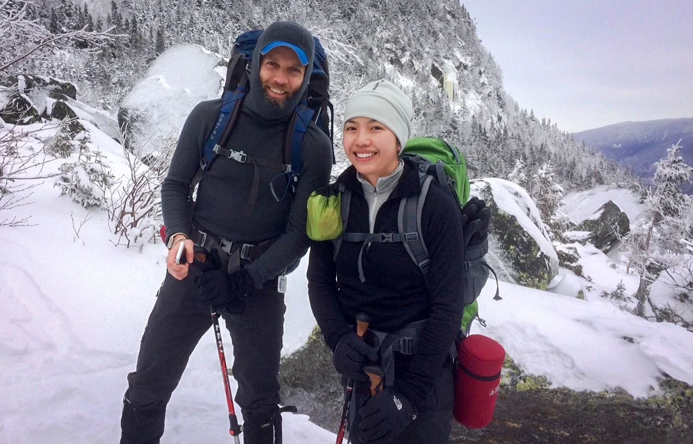 On the left, I'm wearing a Merino Air Hoodie from Patagonia. It is light like polyester, breathes well, and has an awesome stretchy balaclava style hood. But, boy is it fragile with that loose, lofty weave.
