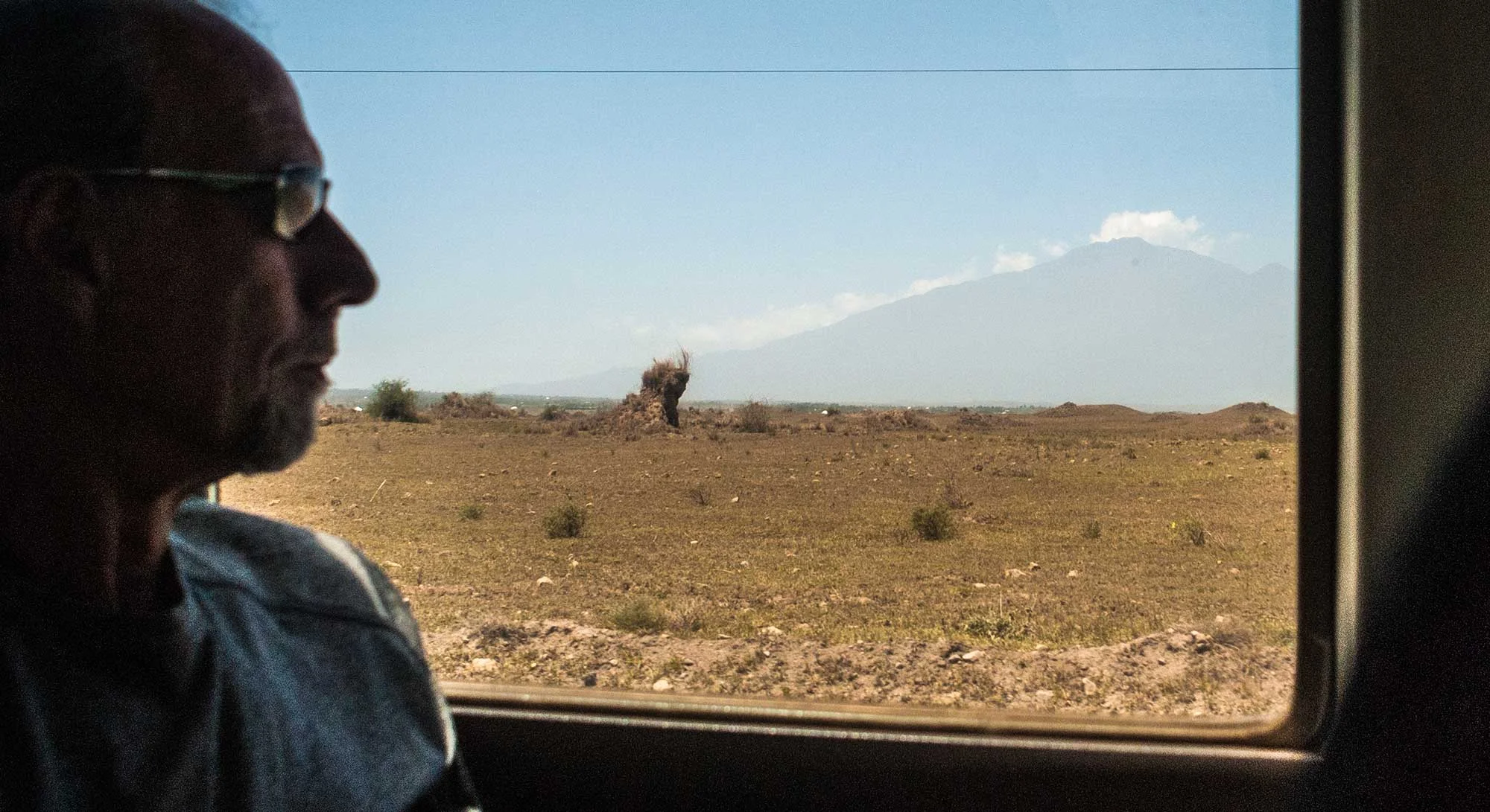 My soon to be trail-buddy, Jon Dobbs enjoys the view as we bounce and careen of rocks and ruts in the overcrowded bus.