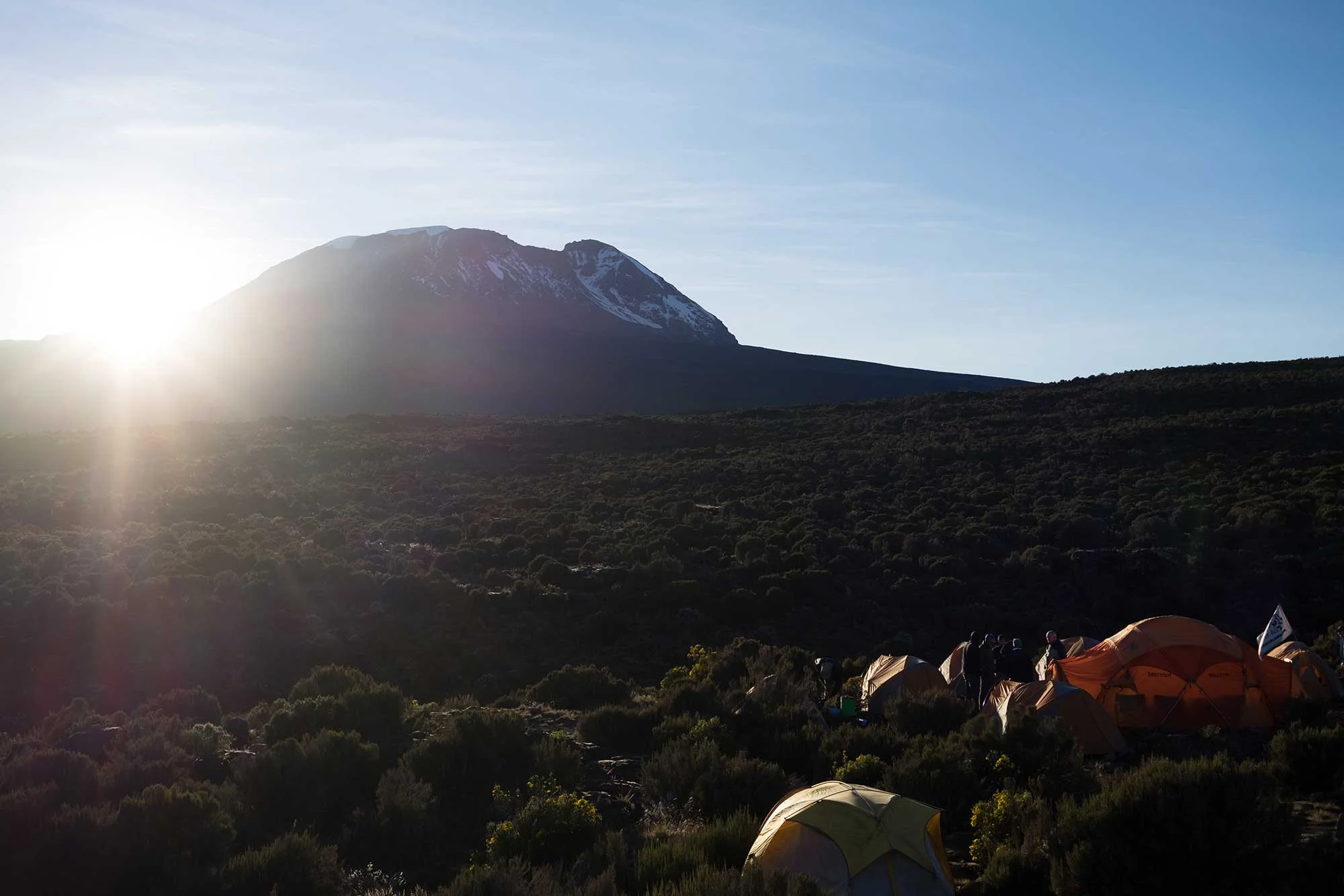 While the team finished packing up, I caught the sun popping up over Kibo and bringing some welcome warmth to our camp.